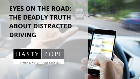 Distracted driver holding cell phone while driving